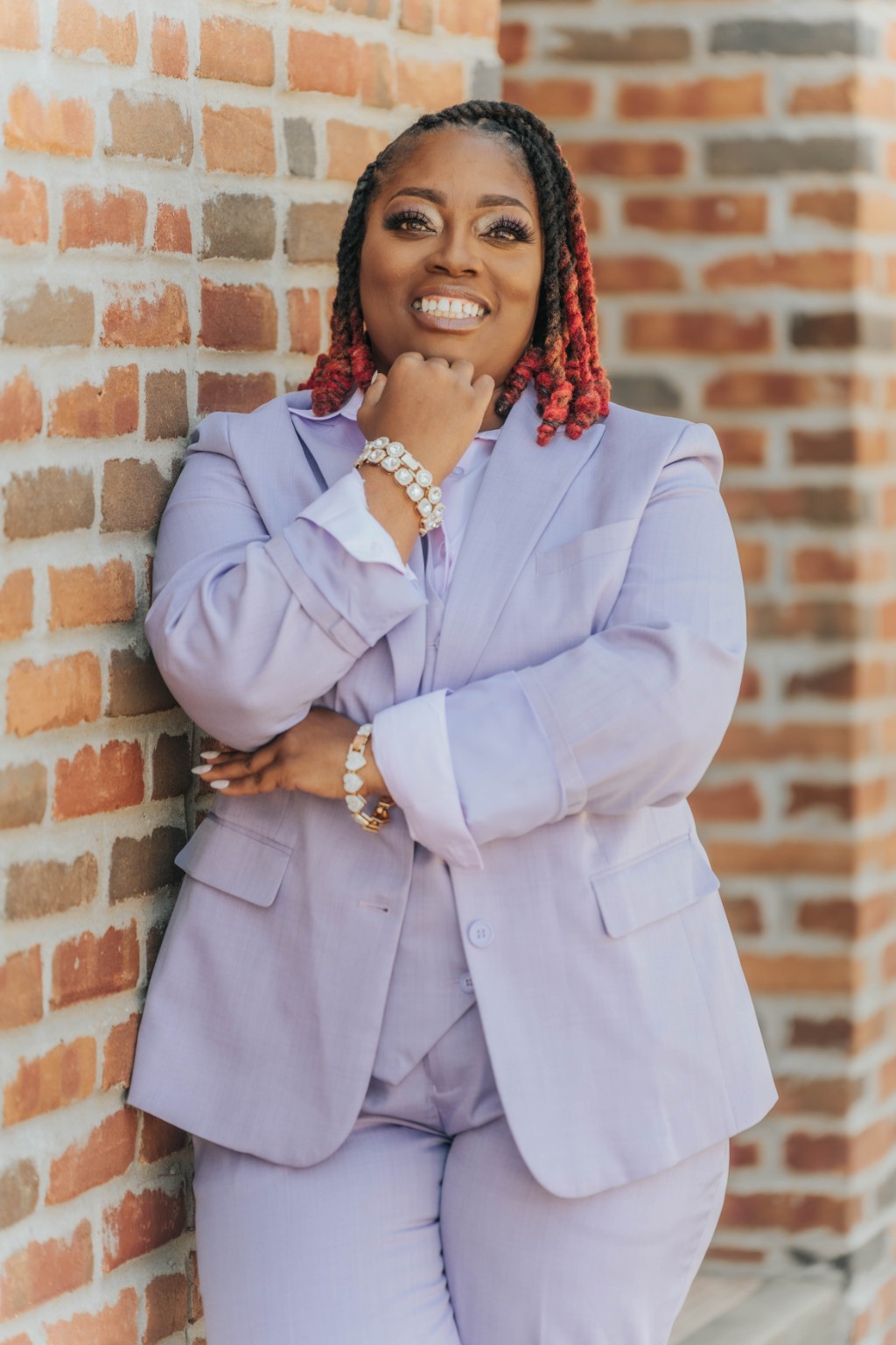 Portrait of Sophia Downs in a lavender suit